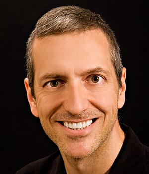 man in black smiling
