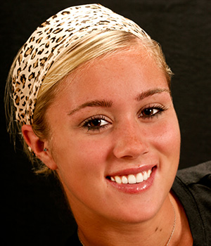 woman with cheetah headband smiling
