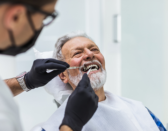 Senior man receiving a dental exam