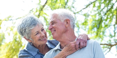 Senior couple with dentures in Windermere, FL outside