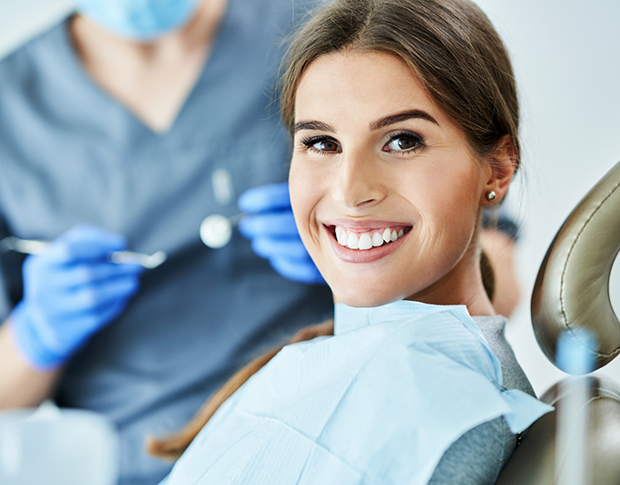 Woman grinning in the dental chair