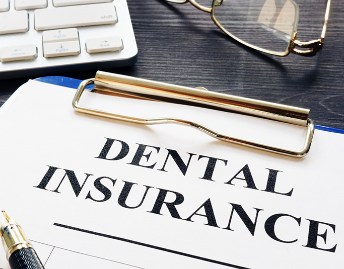 Dental insurance form on a clipboard