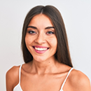 Young brunette woman showing off her smile with flawless teeth
