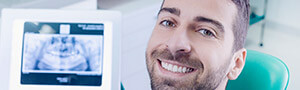 man smiling by x-ray