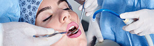 woman having dental checkup with sedation