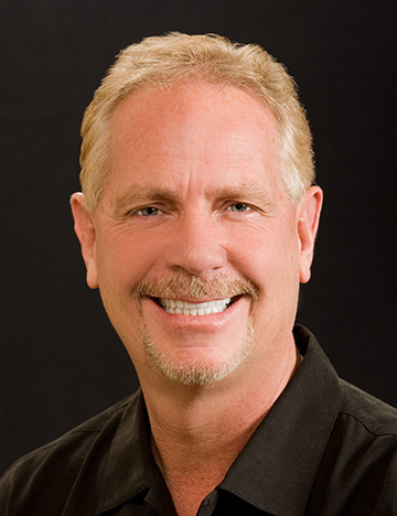 Older man showing off his smile with flawless teeth