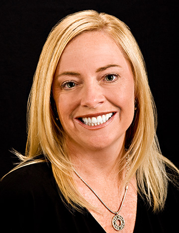 Blonde woman with flawless teeth smiling