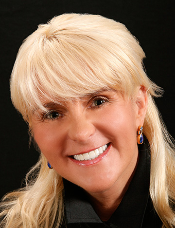 Smiling blonde woman with much whiter teeth