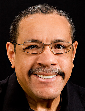 Older man smiling with newly restored and whitened teeth