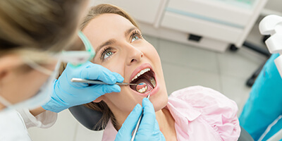 woman in pink getting checkups