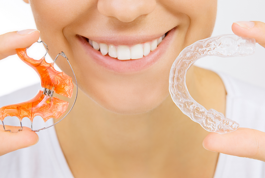 Woman holding clear retainer