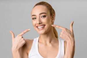 Woman smiling after getting her misalignment corrected
