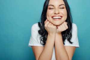 Woman smiling after cosmetic dentistry.