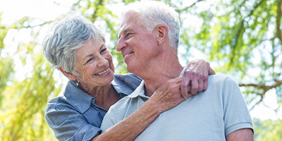 Senior couple with dentures in Windermere, FL outside