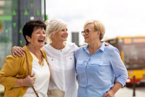 Group of people smiling and having a conversation