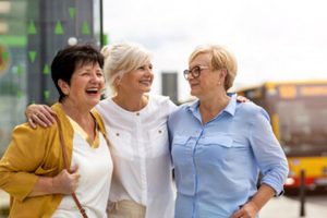 Group of people smiling and having a conversation